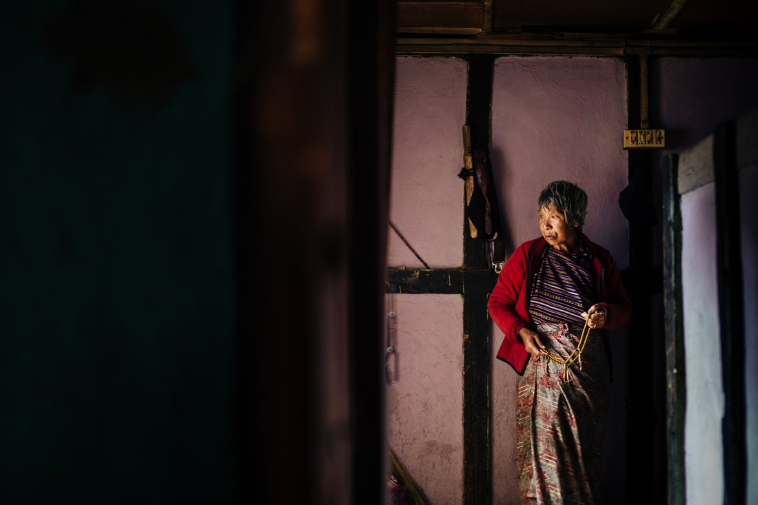 Bhutanese grandmother in home